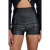 A close-up front view photograph of a woman wearing high-waist, matte black synthetic leather shorts with detailed vertical paneling. She is also wearing an open black ribbed cardigan. The background is plain white.